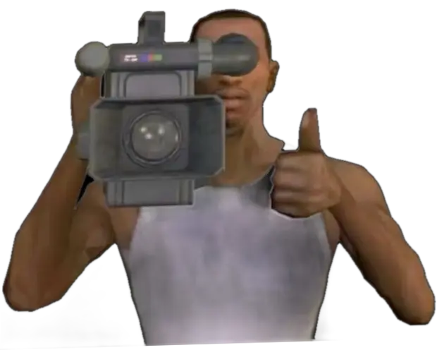 Man filming with a camcorder, thumbs up